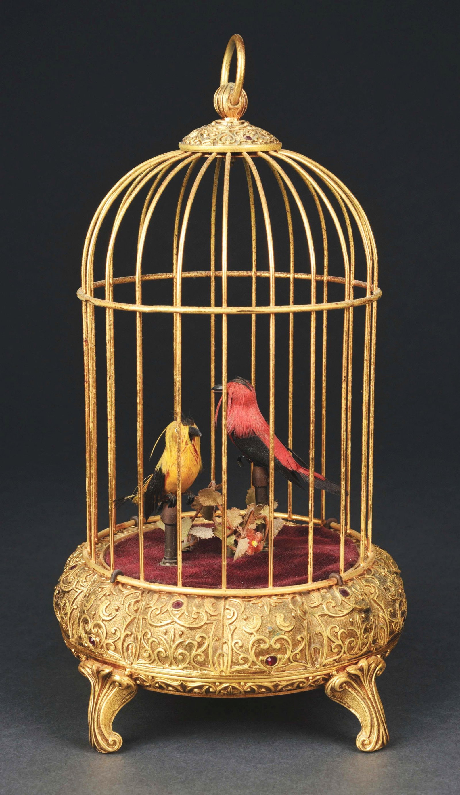 WEST GERMAN WIND-UP SINGING RED AND YELLOW BIRDS IN CAGE: A very good example of an early singing bird cage with two birds. The birds have great action, with moving heads, beaks and flapping original tail feathers. CONDITION: Good sound and tone. The bird ca