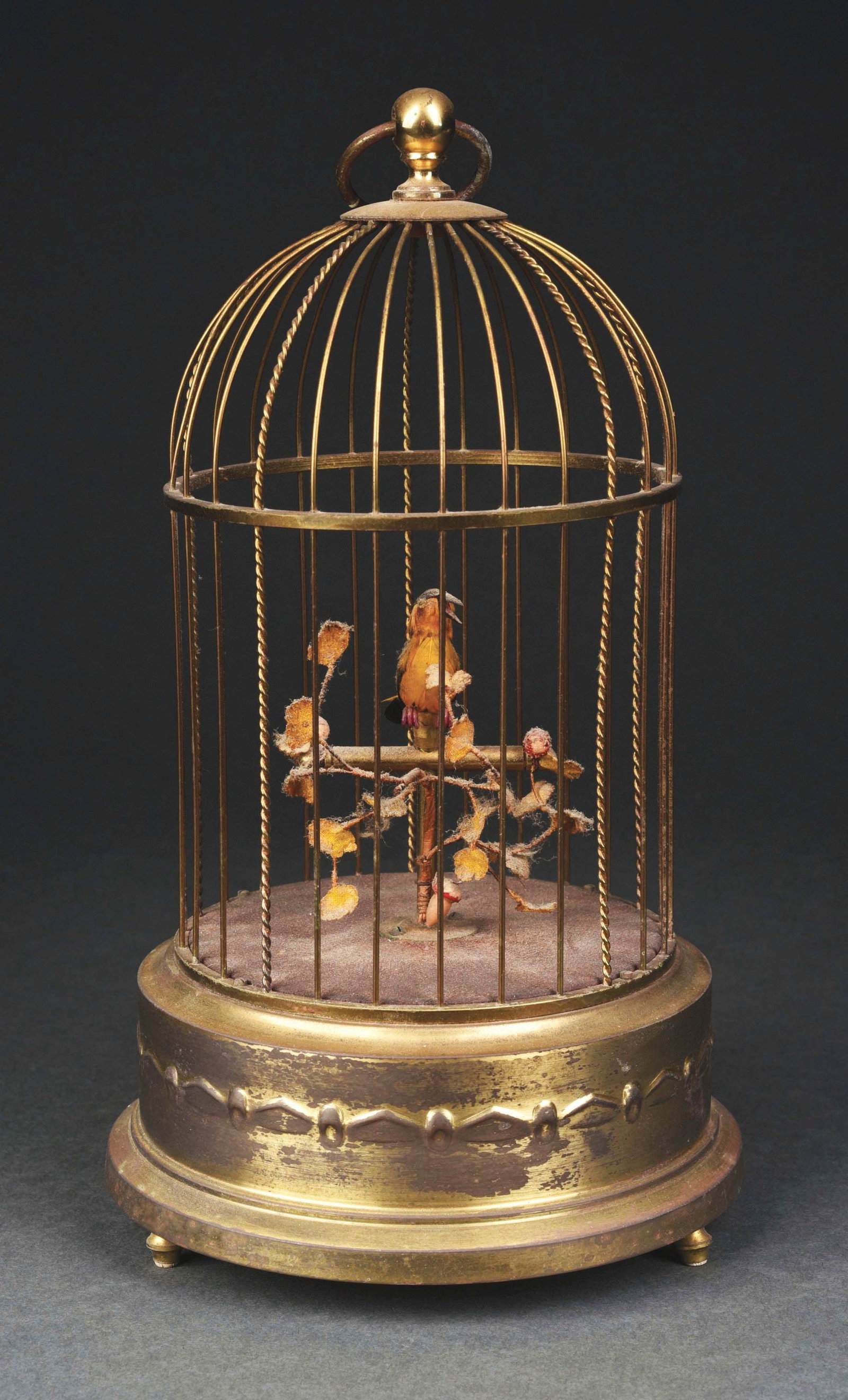 GERMAN WIND-UP SINGING BIRD IN CAGE AUTOMATON: This is a period German singing bird cage with a single bird in original condition. CONDITION: Bright brass cage, all original feathers and working with great sound. Condition: (Very Good) Item Dimens