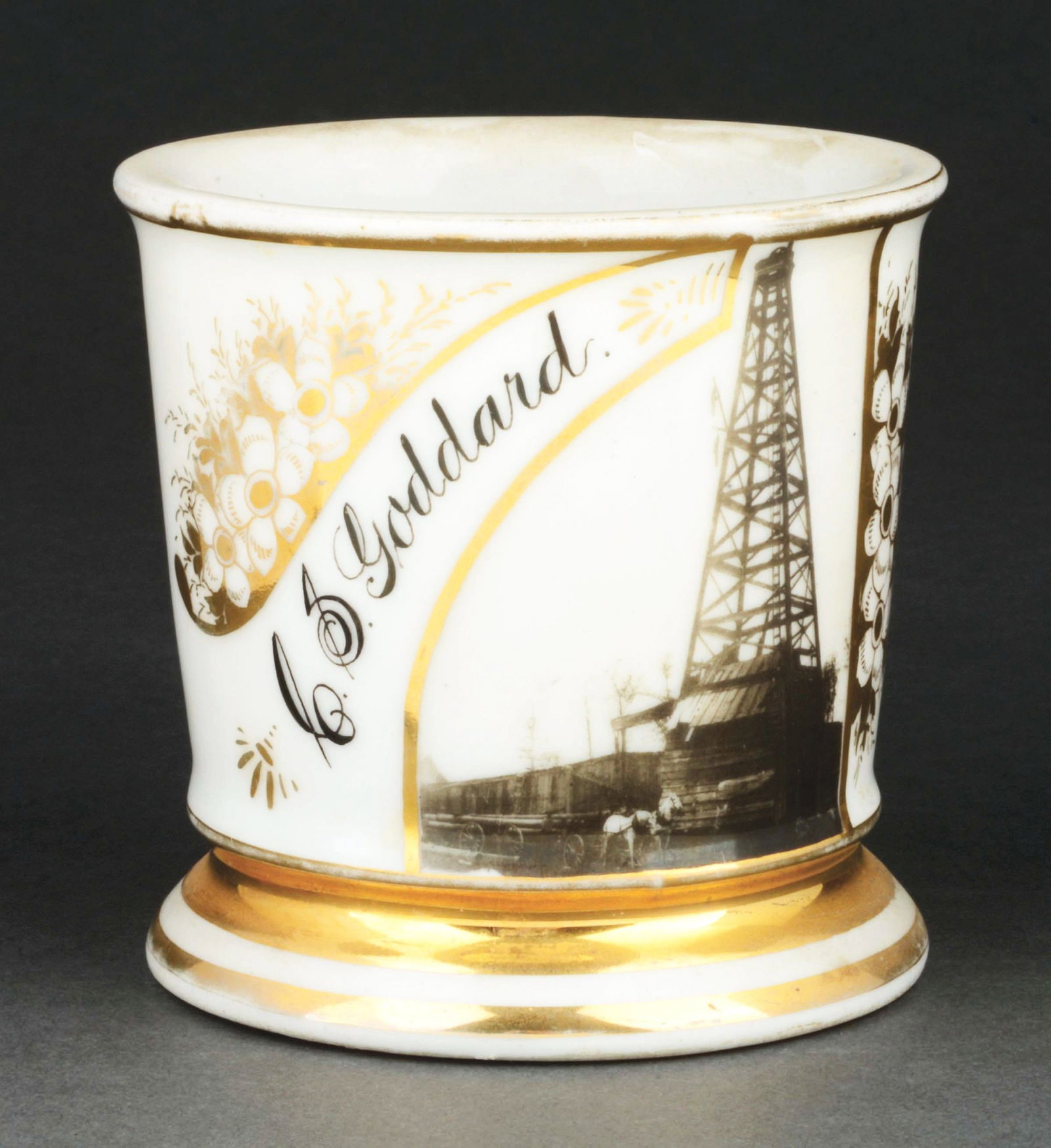 OILRIG PHOTOGRAPHIC SHAVING MUG.: Has the name "C.S. Goddard" in gold gilt. Mug is stamped "Austria" under base. Nice photographic image of oilrig with horse-drawn cart in front. Condition: (Excellent). Item Dimensions: 4 - 1/2" x 3 -