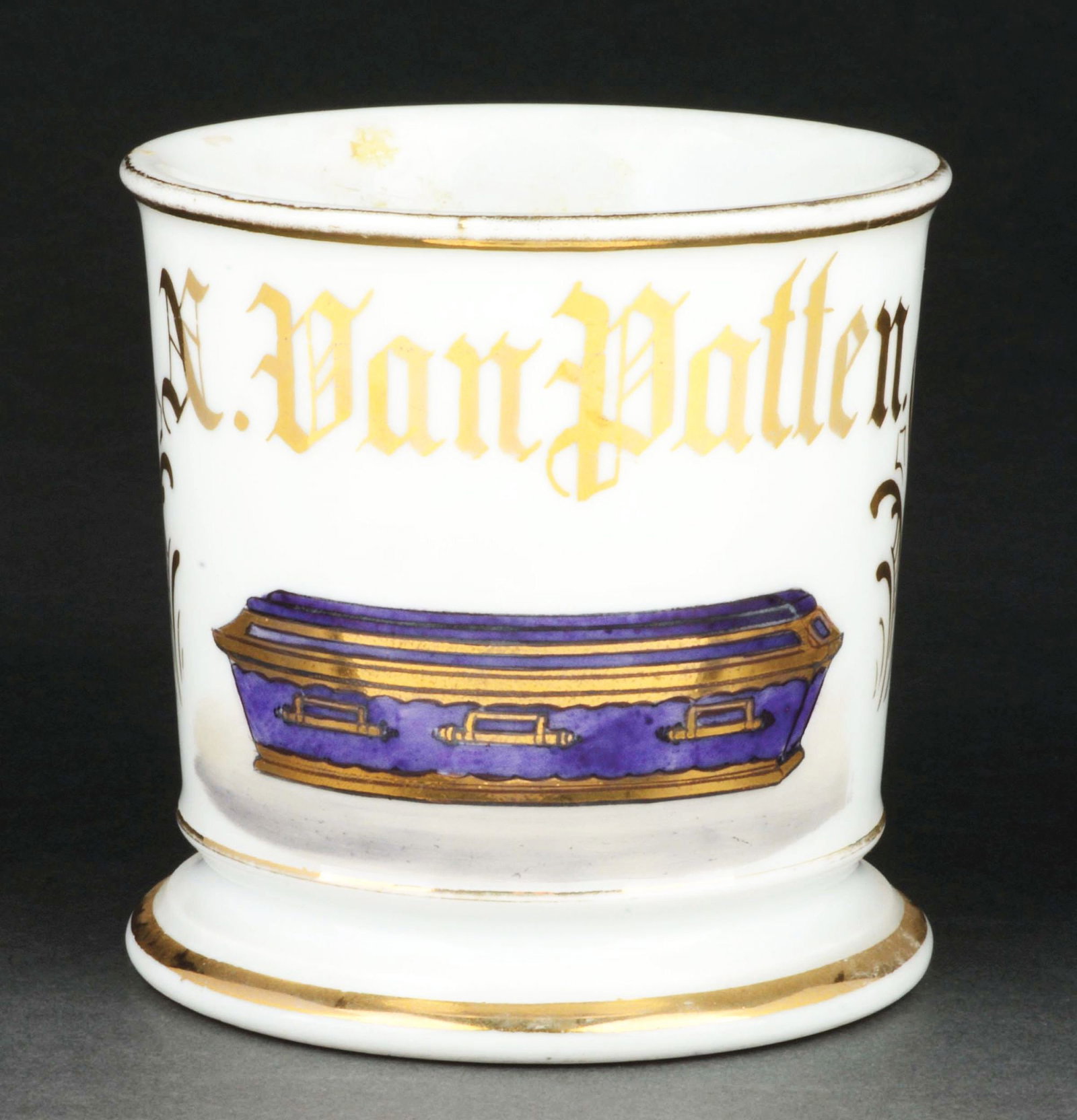 CASKET BUILDER SHAVING MUG.: Has the name "N. Van Patten" in gold gilt. Stamped "T&V Limoges France." Detailed image of an early casket done in purple and gold gilt. Condition: (Excellent). Item Dimensions: 4 - 3/4" x 3 - 3/4" x 