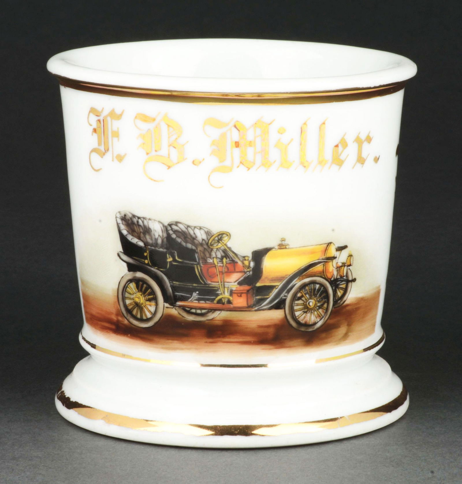 TOWN CAR OPERATOR SHAVING MUG.: Has the name "F.B. Miller" in gold gilt. Mug is stamped "T&V Limoges France" under base. Detailed image of early automobile. Condition: (Excellent). Item Dimensions: 4 - 1/2" x 3 - 1/2" x 3 - 1/2".