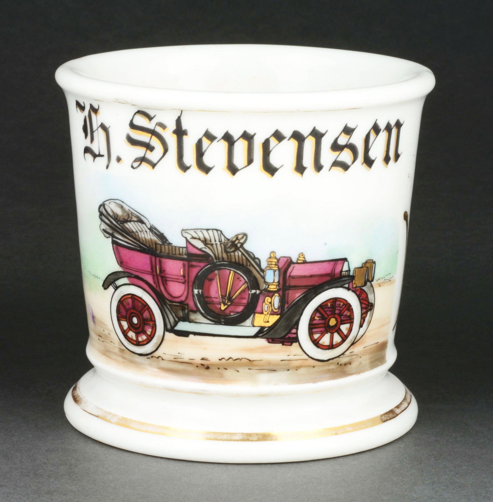 AUTOMOBILE OPERATOR SHAVING MUG.: Has the name "H. Stevensen" in gold gilt. Mug is stamped "T&V Limoges France" under base. Beautiful image of early automobile with gold gilt highlights. Condition: (Excellent). Item Dimensions: 4 - 3/