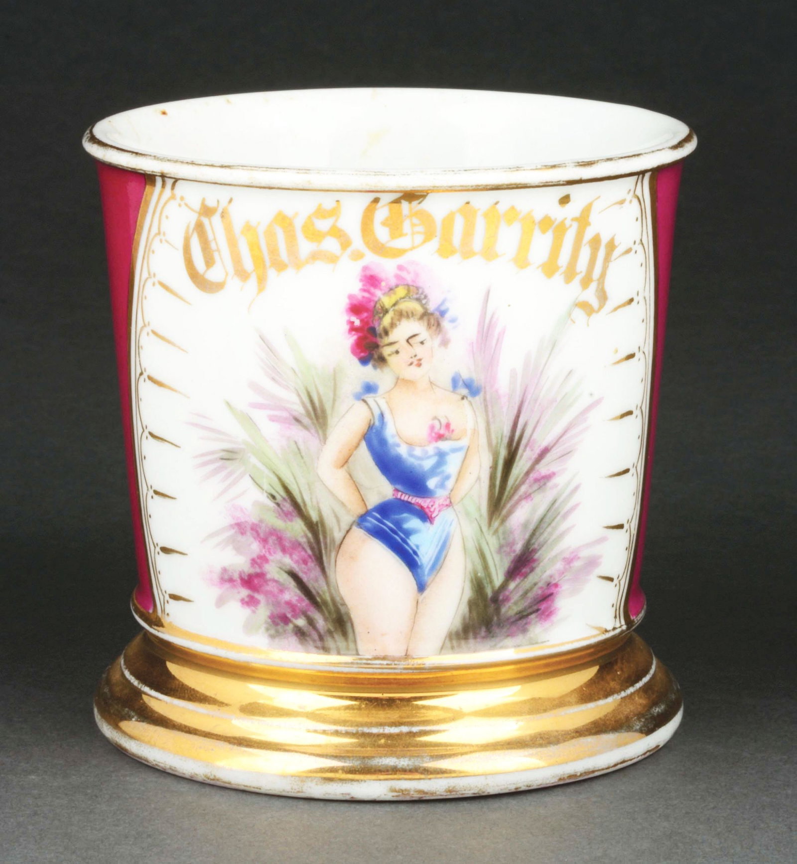 PROSTITUTE SHAVING MUG.: Has the name "Chaz Garity" in gold gilt. Purple wrap. Mug is stamped "T&V Limoges France." Detailed image of lady dressed in risqué clothing. Condition: (Excellent). Item Dimensions: 4 - 3/4" x 3