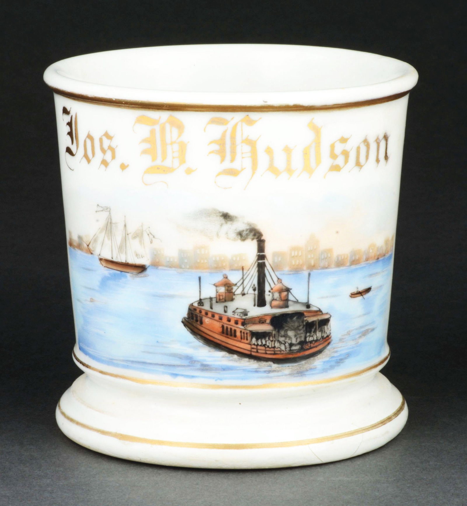 STEAM SHIP OPERATOR SHAVING MUG.: Has the name "Jos. B. Hudson" in gold gilt. Mug is stamped "T&V France" under base. Nice image of steam-driven boat with city in background. Small hairline on base. Condition: (Excellent). Item Dimens