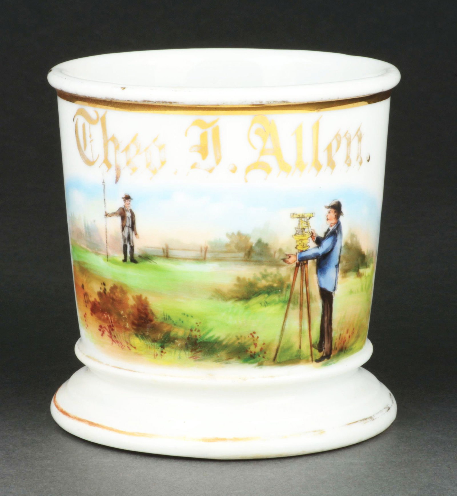 LAND SURVEYOR SHAVING MUG.: Has the name "Theo A. Allen" in gold gilt. Stamped "T&V Limoges France" under base. Detailed image of men surveying property. Condition: (Excellent). Item Dimensions: 4 - 3/4" x 3 - 3/4" x 3 - 3/4".