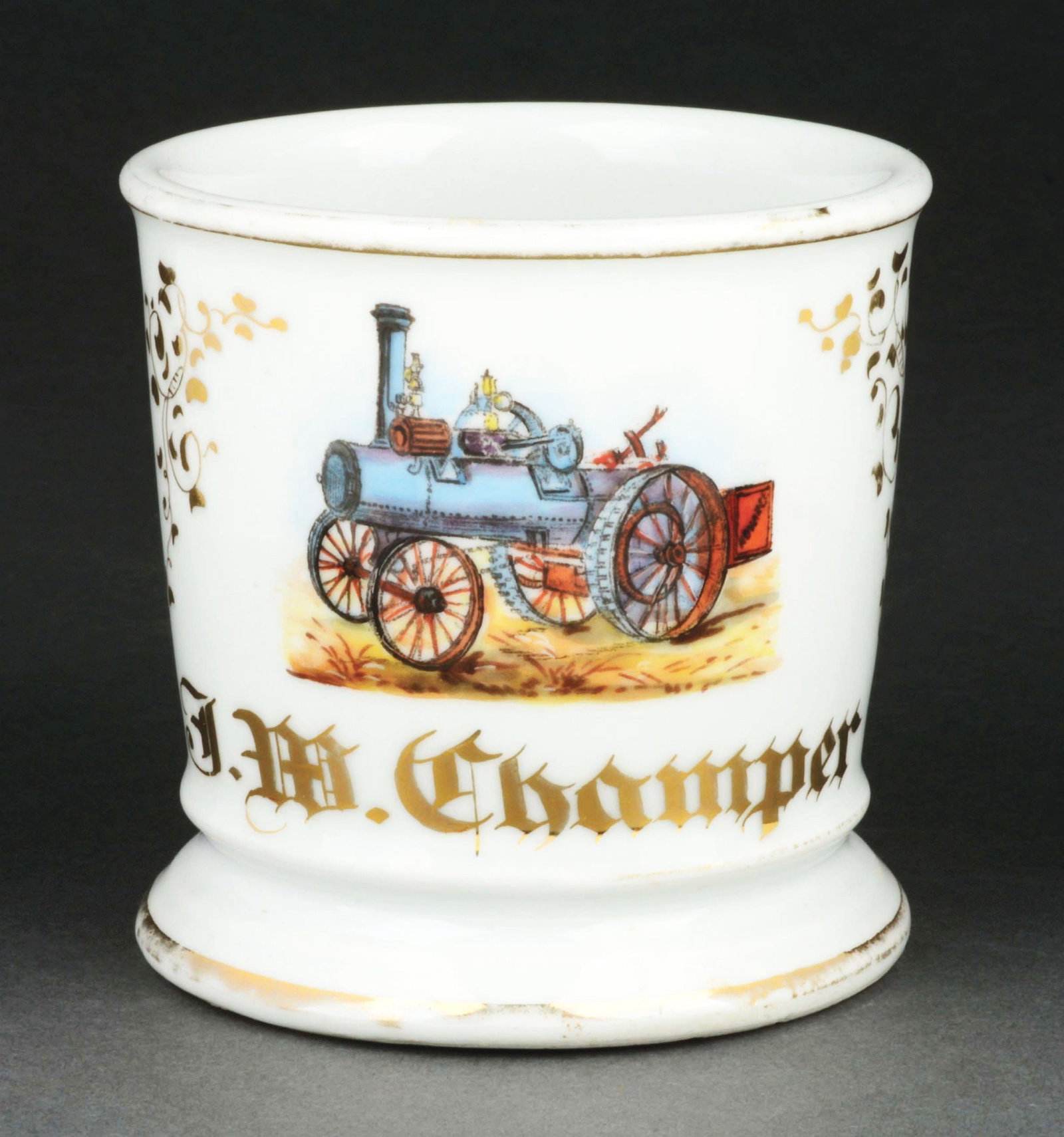 STEAM TRACTOR OPERATOR SHAVING MUG.: Ha the name "J.M. Champer" in gold gilt. Detailed image of steam-driven tractor. Condition: (Excellent). Item Dimensions: 4 - 1/2" x 3 - 1/2" x 3 - 1/2".