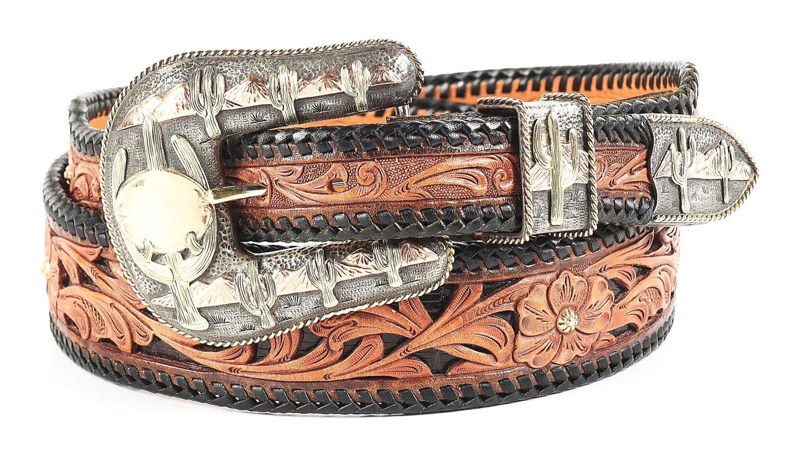 DAZZLING EDWARD H. BOHLIN "ARIZONA" BUCKLE SET ON A HOWARD KNIGHT FILIGREED LEATHER BELT: Edward H. Bohlin / Hollywood / CA maker-marked sterling silver and three-color gold “Arizona” pattern buckle set with a 1” belt opening. Meticulous attention to detail on this Americ