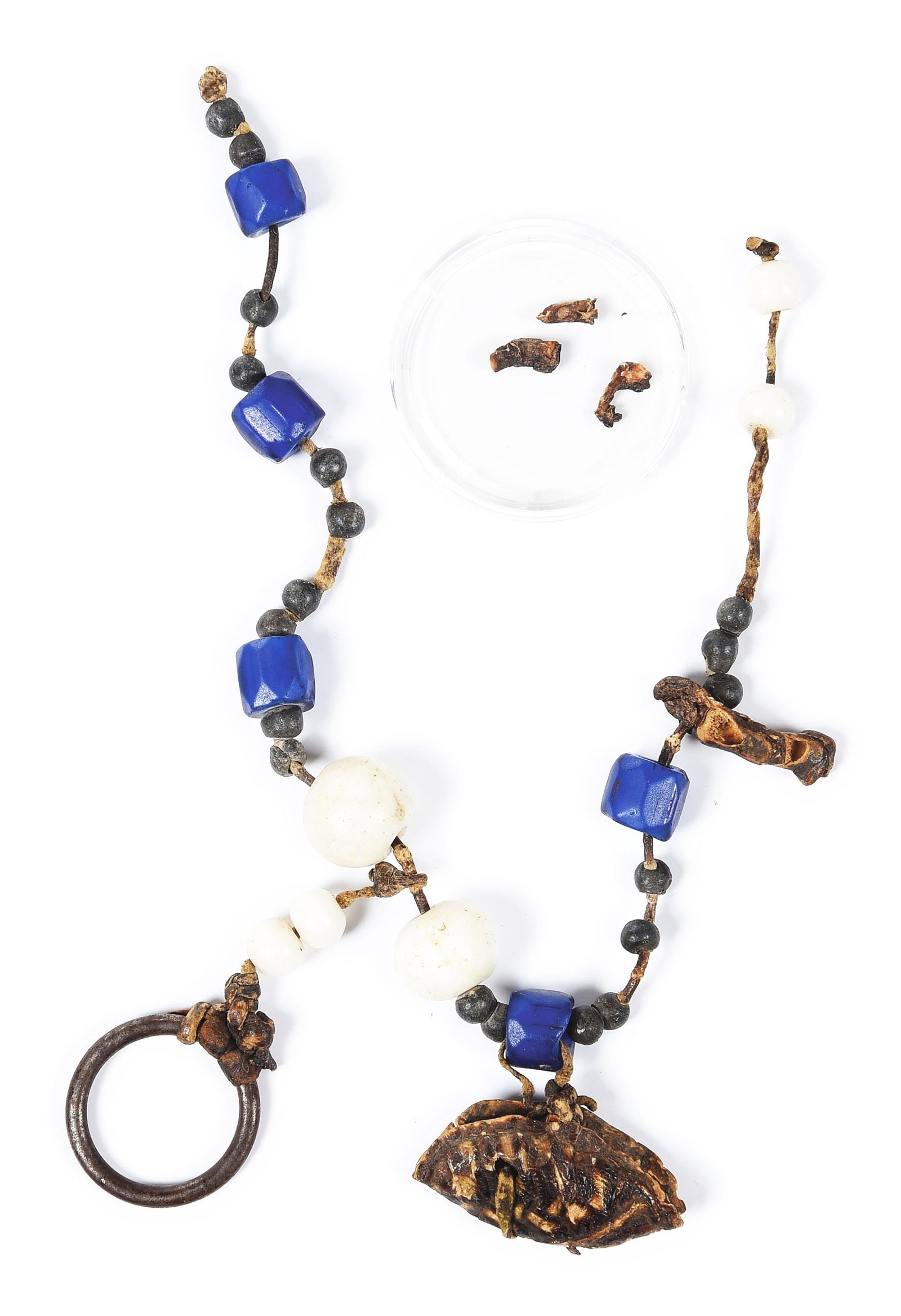 GERONIMO'S BEAD AND BONE NECKLACE: A classic Apache style necklace consisting of large beads, metal beads, turtle bone, fetishes and leather, done in the traditional Apache style. Similar necklaces can be seen in period photographs of 