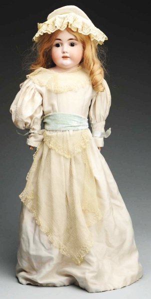 Lovely German Bisque Child Doll.: Shoulder head incised “P Made in Germany” by J.D. Kestner, multi-stroked eyebrows, sleeping eyes with painted upper and lower eyelashes, plaster dome, replaced human hair wig; kid body (replaced u