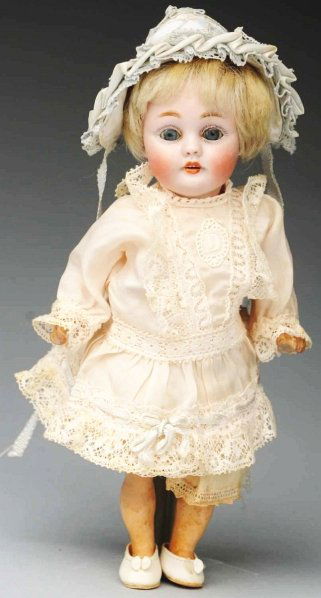 Darling Kestner Child Doll.: Bisque socket head incised “f made in Germany 2/0 143”, blue sleeping eyes, molded upper eyelid, multi-stroked light brown eyebrows, painted upper and lower eyelashes, open mouth with 4 molded upp