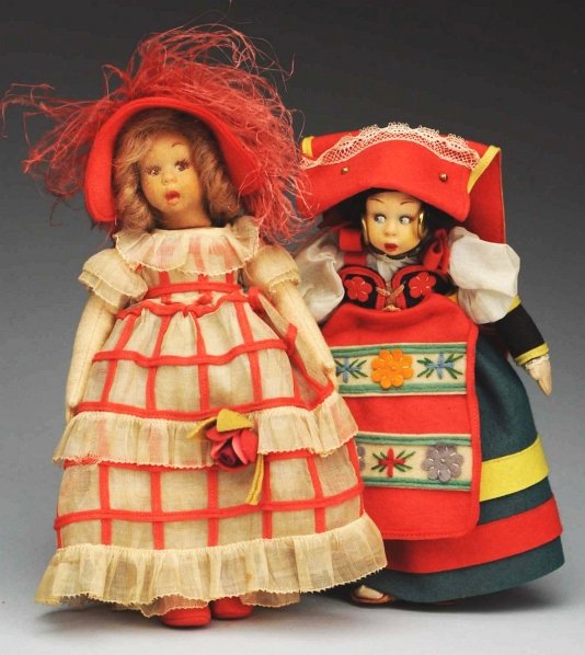 Lot of 2: Miniature Lenci Dolls.: Molded felt faces with surprised side-glancing eyes, painted upper eyelashes, open/closed mouths. Original clothing on both dolls. Both have Lenci tags. Light fading and soil on clothing. Condition (V