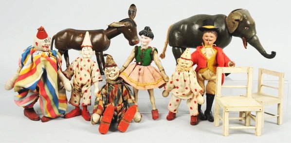 Lot of 10: Schoenhut Figures & Accessories.: American. Includes four clowns, elephant, donkey, ringmaster, female acrobat, and two chairs. Various conditions. Condition (Very Good). Size Largest: 8" L.