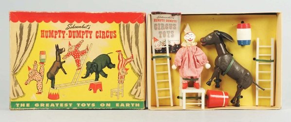 Schoenhut Humpty Dumpty Circus Set.: American. Set is in unused condition and still tied-down to original box insert. Includes one clown, one donkey, two ladders, one chair, one pedestal, and one barrel. Includes very colorful original b