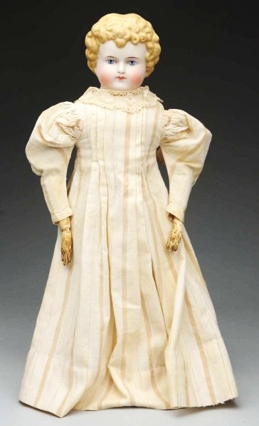 German Bisque Shoulder Head Child.: Unmarked bisque shoulder head probably by Alt, Beck & Gottschalck with short curly blonde 1880s hairstyle, tapered brown eyebrows, blue painted eyes with black eyelash line and red eyelid line, closed