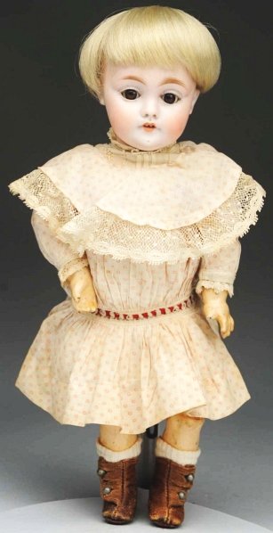 Cute Kestner Character Child.: Bisque socket head incised “a made in Germany 4”, 143 mold but not marked with the mold #, brown sleeping eyes, molded upper eyelid, multi-stroked light brown eyebrows, painted upper and lower eye