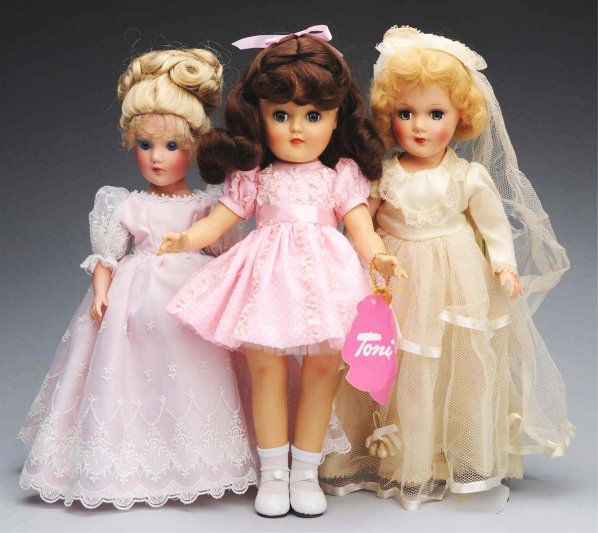 Lot of 3: American Dolls.: Vintage unmarked possibly Mary Hoyer hard plastic bride, all original; 1994 Mary Hoyer limited edition doll in original pink gown; Reissue “Toni” by Effanbee Doll Co., all original. Condition (Exc