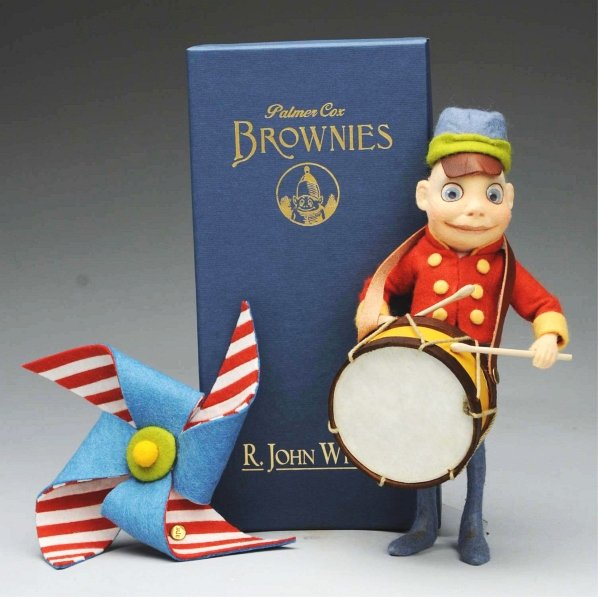 R. John Wright “Strike Up the Band".: All felt Palmer Cox Collection Brownie Band Drummer in an exclusive edition of 175 pieces from 2007. All original and boxed with certificate and set of Brownie notecards and special RJW napkin ring. C