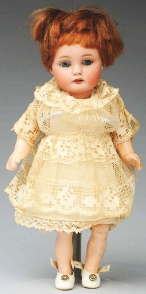 Winsome Kestner Child Doll.: Bisque socket head incised “g made in Germany 4/0 143”, blue sleeping eyes, molded upper eyelid, multi-stroked light brown eyebrows, painted upper and lower eyelashes, open mouth with four molded 