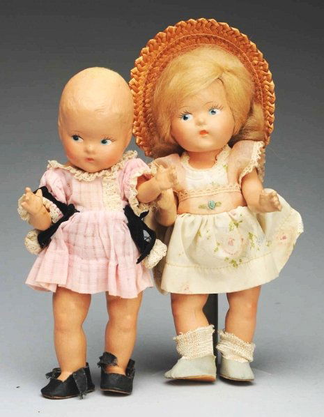 Lot of 2: Vogue “Toddles” Dolls.: All composition marked Vogue or Doll Co., painted side-glancing eyes, one with original mohair wig, one missing wig. Girl in pink with lace trim and attached panties, no socks, snaps broken on shoes,