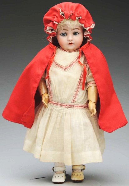 Charming Kestner Character Child.: Bisque socket head incised “C made in Germany 7 143”, blue sleeping eyes, molded upper eyelid, multi-stroked light brown eyebrows, painted upper and lower eyelashes, open mouth with two upper teet