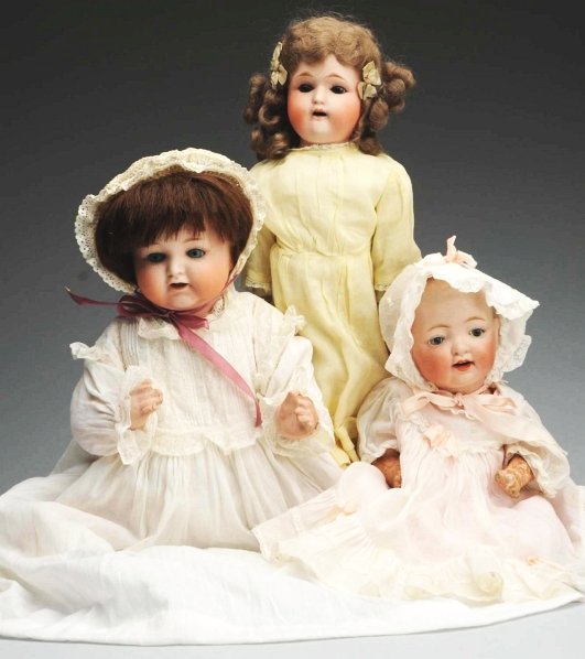 Lot of 3: Japanese Bisque Dolls.: R.E. Nippon bisque shoulder head girl, lovely original mohair wig, sleep eyes, kidilene body with bisque lower arms, original dress and shoes; R.E. Nippon character baby, sleep eyes, replaced wig, com