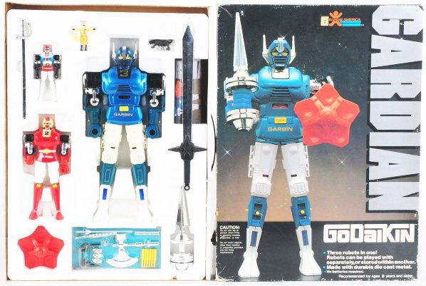 Godaikin Gardian DX.: Bandai. Gardian takes the Russian nesting doll theme to the next robotic level. Robots fit inside each other, down to the rubber driver. Missing cellophane cover and a fist. Broken leg clip (all of th