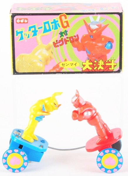Tin Getter G Dragun Wind-Up.: Robin. Spring wind-up Getter tin takes a wind-up and puts Getter Robo G into face-to-face battle with his enemy. Wind-up toy and it oscillates back-and-forth to make fighting action. Condition (Near M