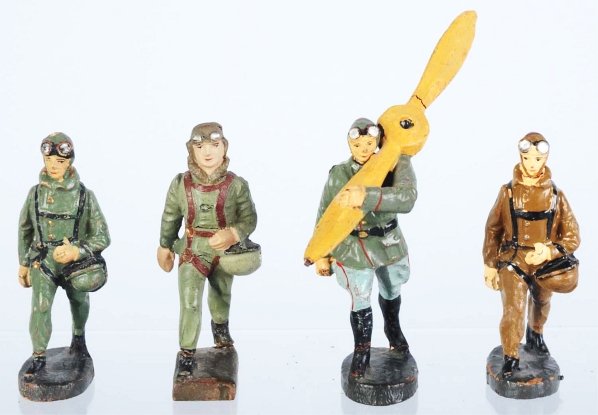 Lot of 4: Lineol & Elastolin Pilots.: Includes four different pilots as shown in photo. Crack in prop. One has substantial touchup. Condition (Very Good - Excellent).