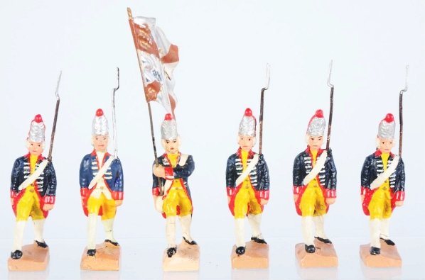 Lot of 6: Lineol Marching Prussians.: Tin flag has major paint loss. Four of the marchers have paint embellishment. Condition (Good).