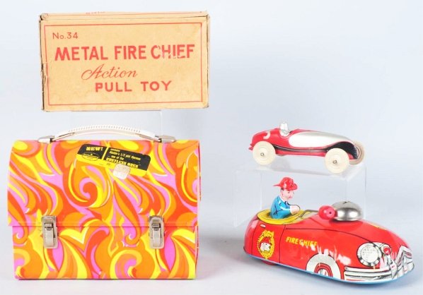 Lot of 3: Tin & Rubber Toys & Lunchboxes.: Includes one psychedelic lunchbox, one Cohn metal Fire Chief pull car in original box, and one Auburn rubber No. 3 Race Car. Box has some creasing and tearing. Condition (Very Good - Excellent). Size 