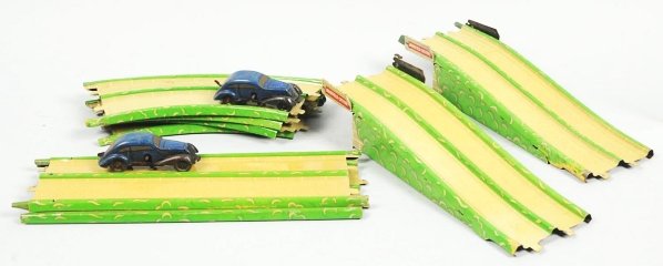 Tin Litho Marx Streamline Speedway Wind-Up Toy.: American. Working. Comes with two wind-up cars and track. Some scratching and wear overall. Includes original box with nice paper label and marked "Made in Great Britain". Condition (Very Good). Size