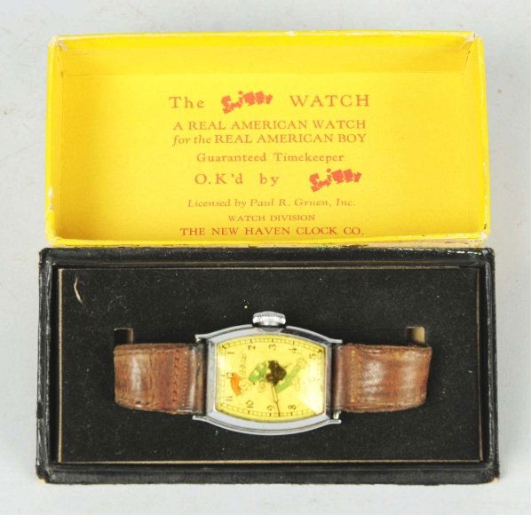 Scarce Smitty Comic Character Wrist Watch.: Circa 1939. Made by New Haven and licensed by Paul R. Gruen, Inc. Large rectangular chromium case. Smitty is wearing his hat, sweater, and knickers. Watch is not over-wound but is still not working. A