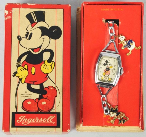 Walt Disney Mickey Mouse Character Wrist Watch.: Circa 1937 to 1938. Made by Ingersoll. Working. Rare girl's watch with metal band and Donald and Minnie metal charms. Includes even rarer Fred Astaire box with original insert. Box has some creasing a