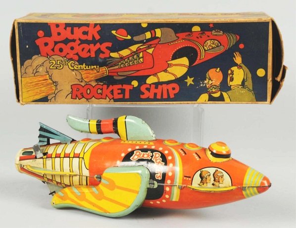 Tin Marx Buck Rogers Rocket Ship Wind-Up Toy.: American. Working. Rocket Fighter has original tail fin but does have significant pitting and water damage to one side. Includes complete and very colorful original box. Condition (Good - Very Good). 