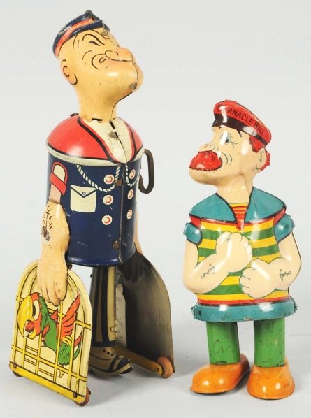 Lot of 2: Tin Litho Character Toys.: Includes one Marx Popeye Walker toy missing pipe and one Chein Waddling Barnacle Bill wind-up toy with paint touchup to left arm. Condition (Very Good). Size Largest: 8" T.