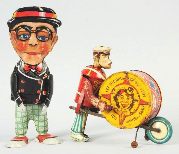 Lot of 2: Tin Litho Marx Character Wind-Up Toys.: Includes one Harold Lloyd-type "Funny Face Walker" with replacement arms and missing cane and one George the Drummer Boy with some oxidation and pitting to drum and right arm. Condition (Very Good). S