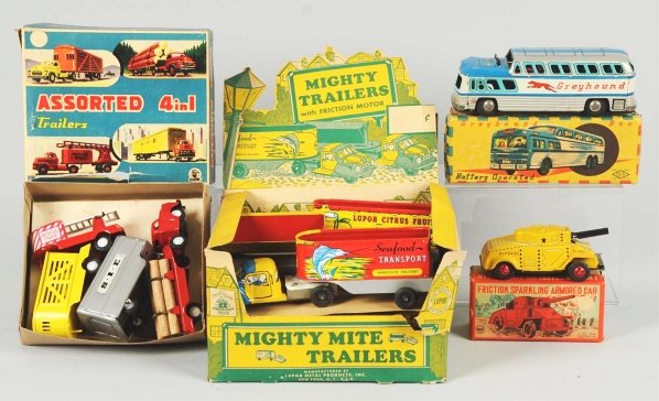 Lot of Assorted Tin Vehicle Toys.: American and Japanese. Includes five Lupor trucks in original store box, one Japanese SSS four-piece friction truck set in original box with some tearing, one Linemar friction armored car in original