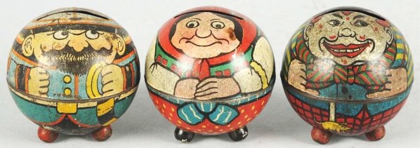 Lot of 3: Tin Round Fancy Figure Still Banks.: Manufactured by Felix Lasse Tin Toy Manufactory of Leipzig, Germany. Includes one clown with black top hat, one policeman with mustache, beard and red epaulets, and one market woman. Condition (Very G