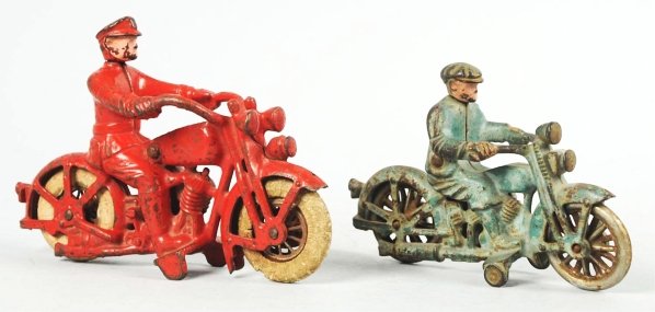 Lot of 2: Hubley Harley Davidson Motorcycle Toys.: American. Cast iron. Both embossed "Harley Davidson" on left sides at gas tanks. Includes one Civilian version with nickel spoke wheels and one Police version with white rubber tires. Some paint loss 