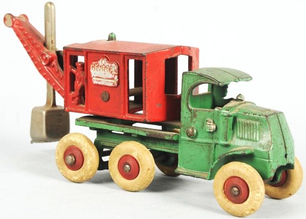 Cast Iron Hubley General Digger Toy.: American. Embossed "General" on both sides of rear. Original scoop and original white rubber tires with red wooden hubs. Missing one rear tire. Some overall wear. Condition (Very Good). Size 8 - 1/2" 