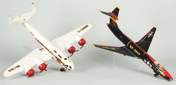 Lot of 2: Vintage Airplane Toys.: Includes one Japanese friction Air Force Bomber missing nose cone and with cracked cockpit cover. Marked "BK-02VF". Also includes one pressed steel Buddy L Air-Cruiser marked "No.-603" on wing. Both w