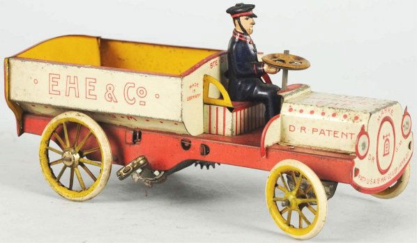 Tin Litho Lehmann Ehe Wind-Up Toy.: German. Working. Marked "Ehe 570 Lehmann" on back. Includes tin litho driver. Some moderate scratching throughout. Condition (Very Good). Size 6 - 3/4" L.