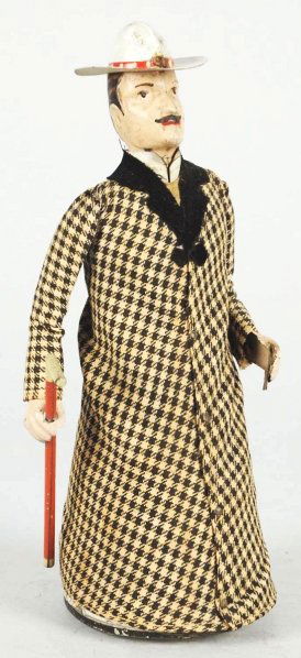 Tin Lehmann Heavy Swell Wind-Up Toy.: German. Includes original cane and key. A few spots of paint flaking to face and hat. Condition (Excellent). Size 8 - 1/2" T.