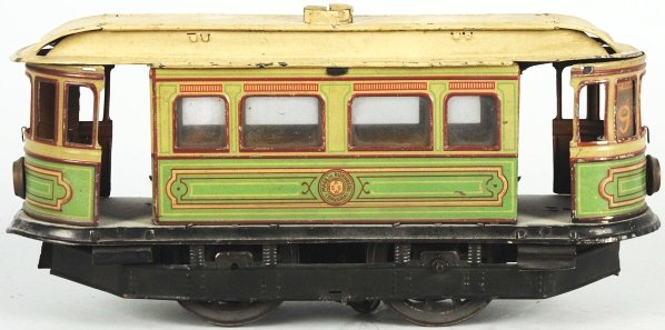 Tin Litho Gunthermann Trolley Car Wind-Up Toy.: German. Working. Lithographed body with hand-painted roof. "SG" Sam Gunthermann mark on side and marked "Made in Bavaria". Interesting track pickup on bottom of mechanism. Some wear and crazing to pai