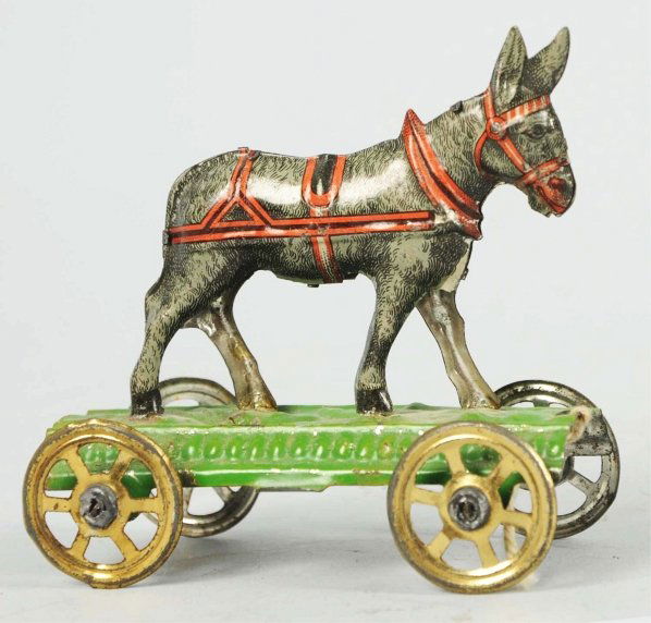 Tin Litho Donkey on Platform Penny Toy.: German. Tin gold-wash wheels. Minor scratching and wear overall. Condition (Very Good - Excellent). Size 3" L.