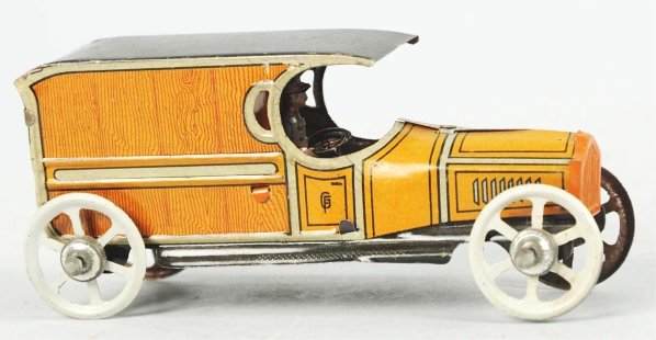 Tin Litho Truck Penny Toy.: German. Marked "Made in Germany" on side of hood. Wood-grain style lithography on rear. Includes original lithographed driver. Minor wear overall. Condition (Excellent). Size 4" L.