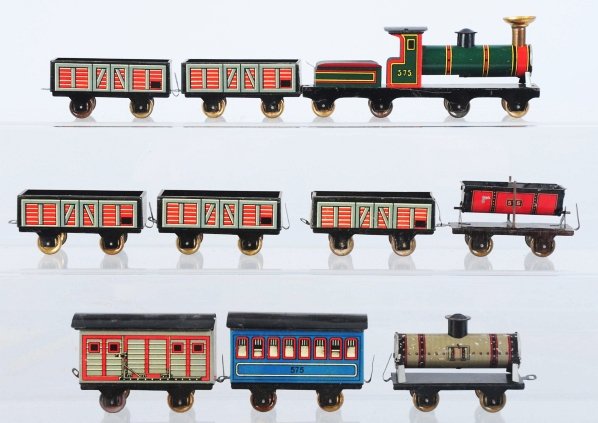 Tin Litho Hess Nickel-Size Train Set.: German. Set consists of a combination steam engine and tender marked "575" and nine passenger and freight cars. Some minor scratching to train. Includes original box with beautiful color label and one