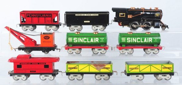 Lot of O-Gauge Electric & Wind-Up Train Sets.: Includes one wind-up Hafner set in original box (missing one side apron) that includes an engine, tender, and three freight cars. Also includes one electric American Flyer set with steam engine, seven