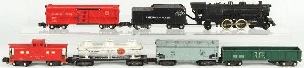 American Flyer S-Gauge Freight Train Set.: American. Includes no. 3020 steam engine and tender marked "Reading Lines" along with four freight cars and one Reading Caboose. Set is dirty and may clean to a better grade. Cars come with individual