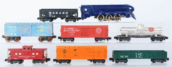 American Flyer S-Gauge Royal Blue Freight Set.: Includes engine, six freight cars, and one caboose. Tender is not included. Includes six original boxes for the cars. Condition (Very Good).